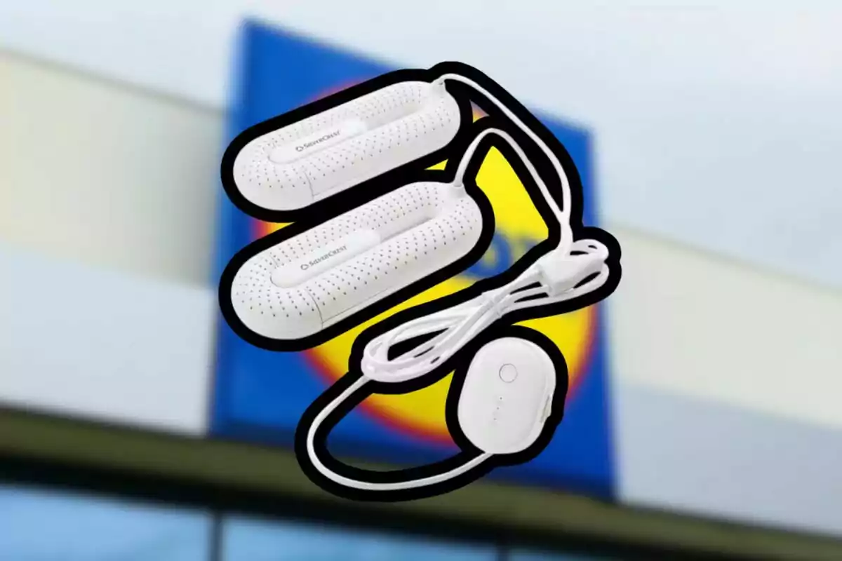 Silvercrest brand electric dehumidifier with a blurred supermarket sign in the background.