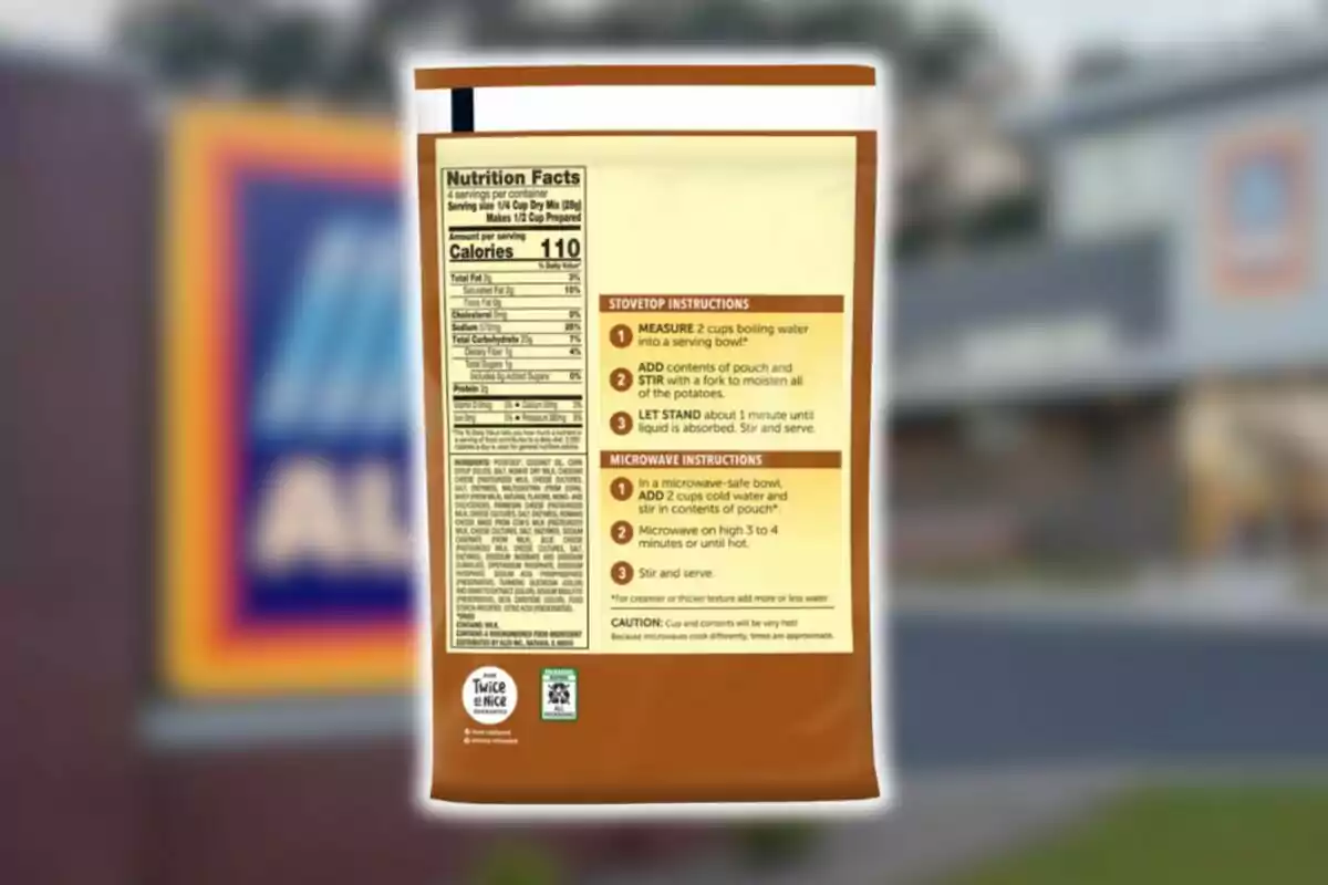 Food bag with nutritional information and preparation instructions visible on the back, with a blurred background of an Aldi store in the US.