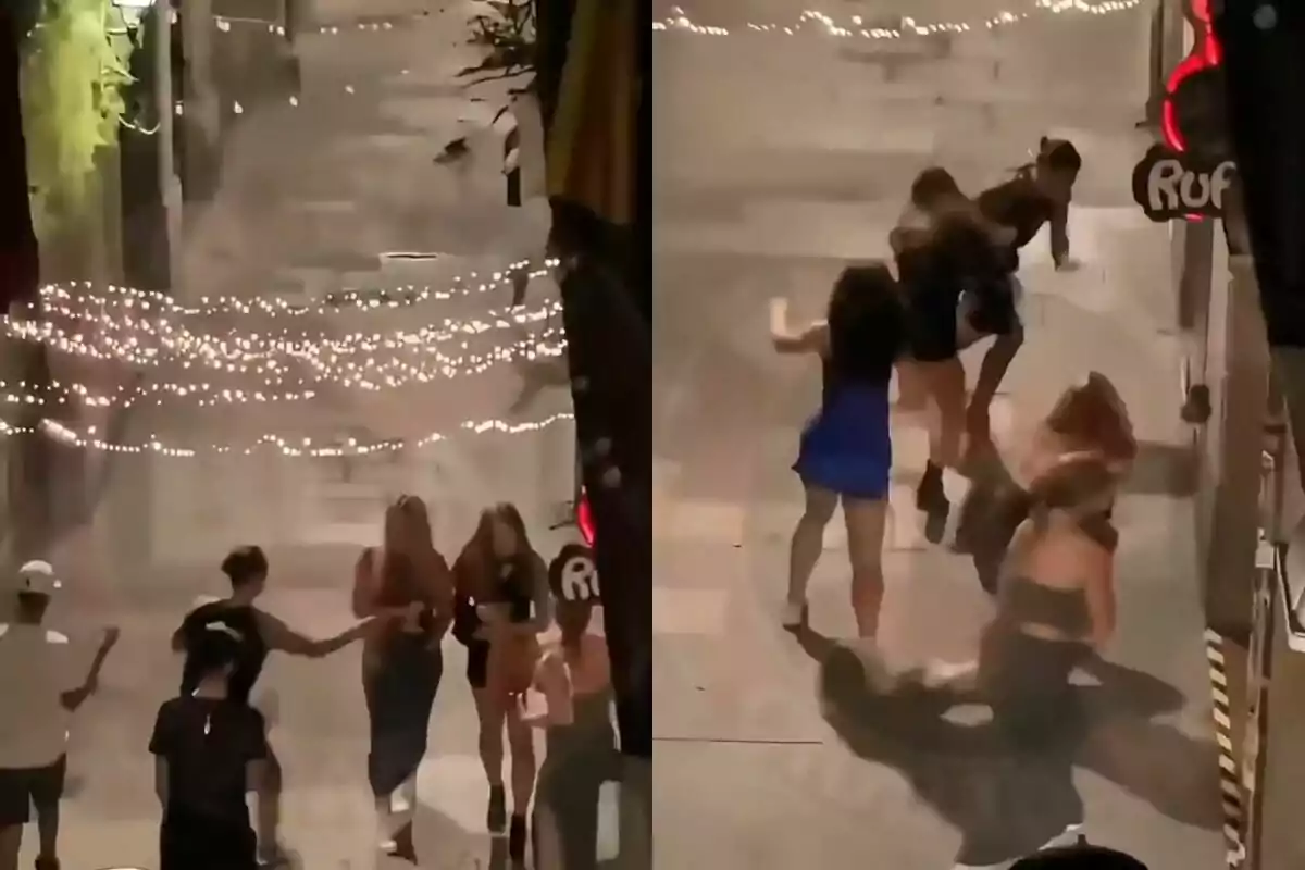 Grupo de personas caminando y luego cayendo en una calle iluminada con luces decorativas por la noche