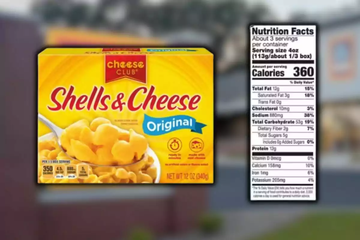 Box of Cheese Club Shells & Cheese Original pasta from Aldi next to a nutrition facts label. Box of Cheese Club Shells & Cheese Original pasta from Aldi next to a nutrition facts label.