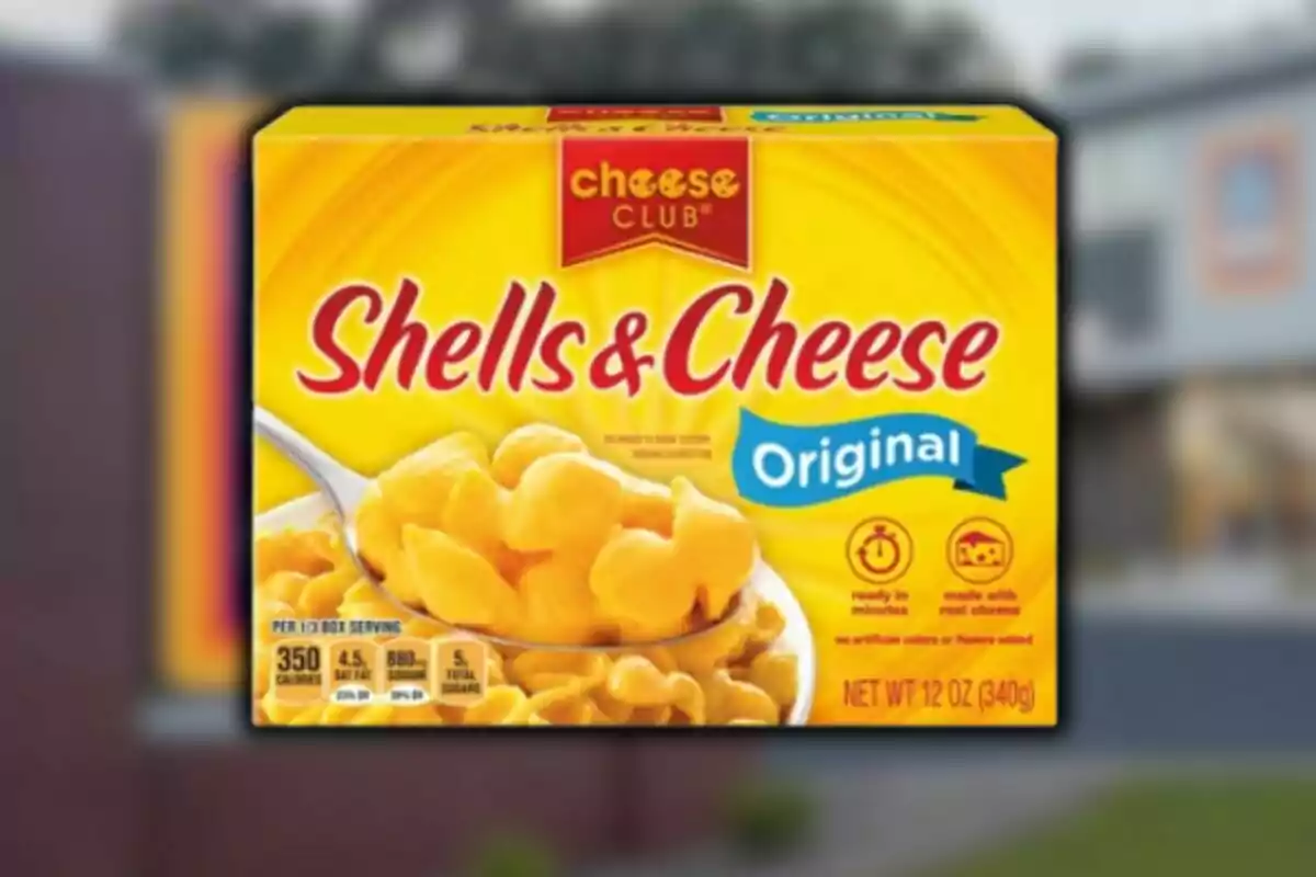 Cheese Club brand original flavor macaroni and cheese box from Aldi with an image of shells covered in cheese sauce. Cheese Club brand original flavor macaroni and cheese box from Aldi with an image of shells covered in cheese sauce.