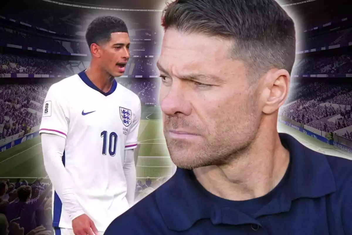 Un jugador de futbol amb l’uniforme d’Anglaterra i un home de cabell curt en primer pla, tots dos en un estadi ple d’aficionats.