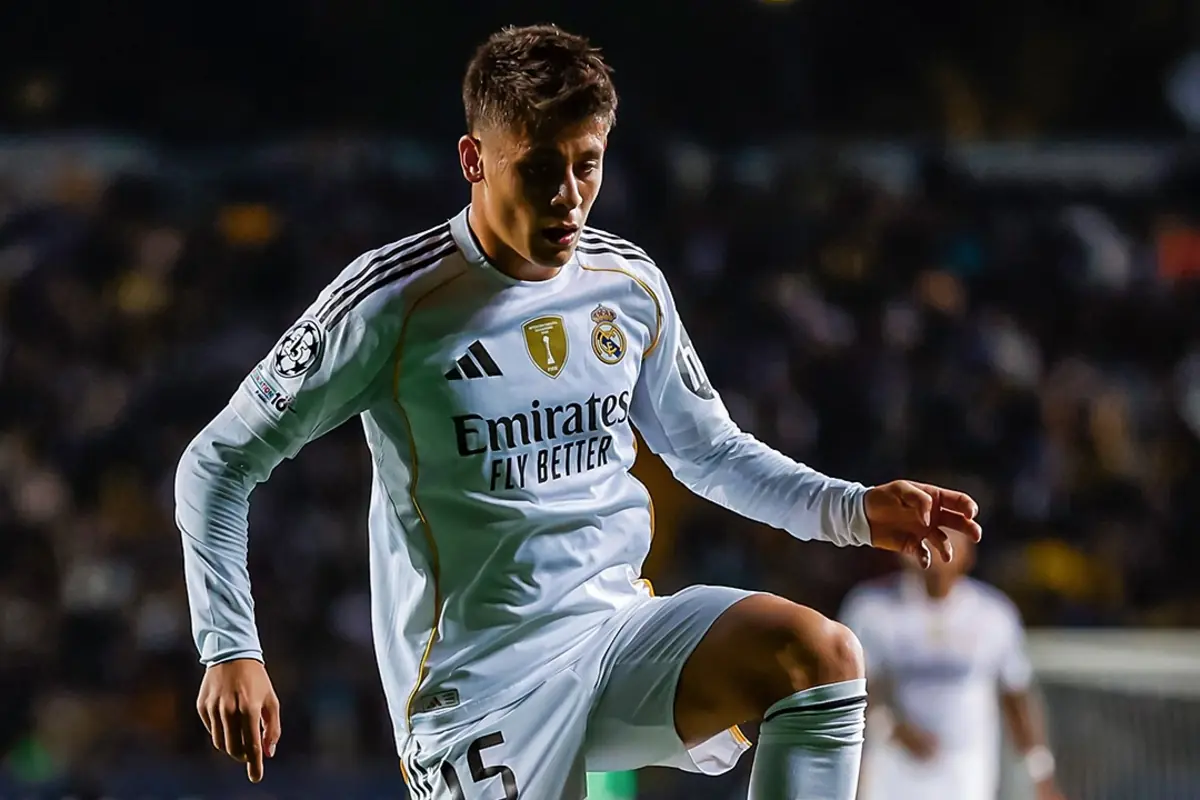 Real Madrid player controlling the ball during a night match