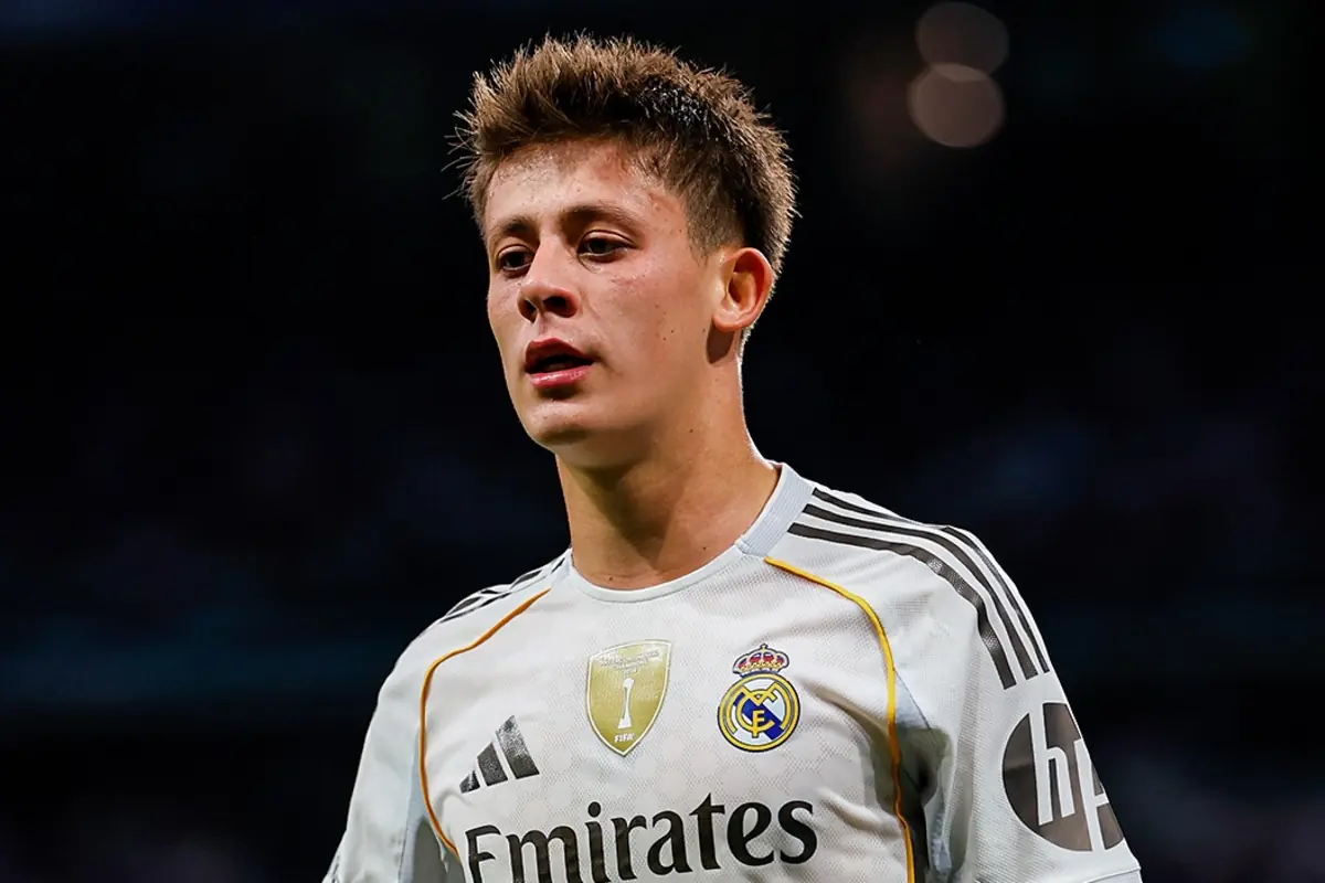 Young player in a white Real Madrid uniform during a match