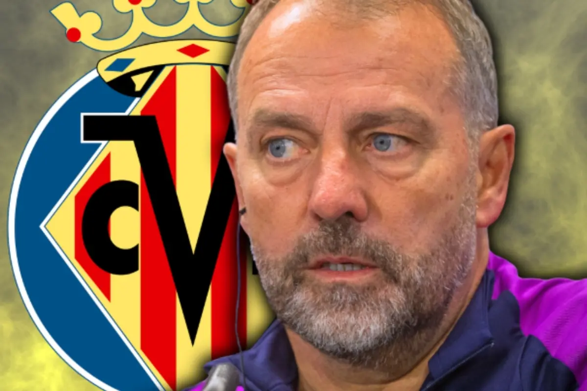 Hombre de barba y cabello corto con expresión seria frente al escudo del Villarreal CF