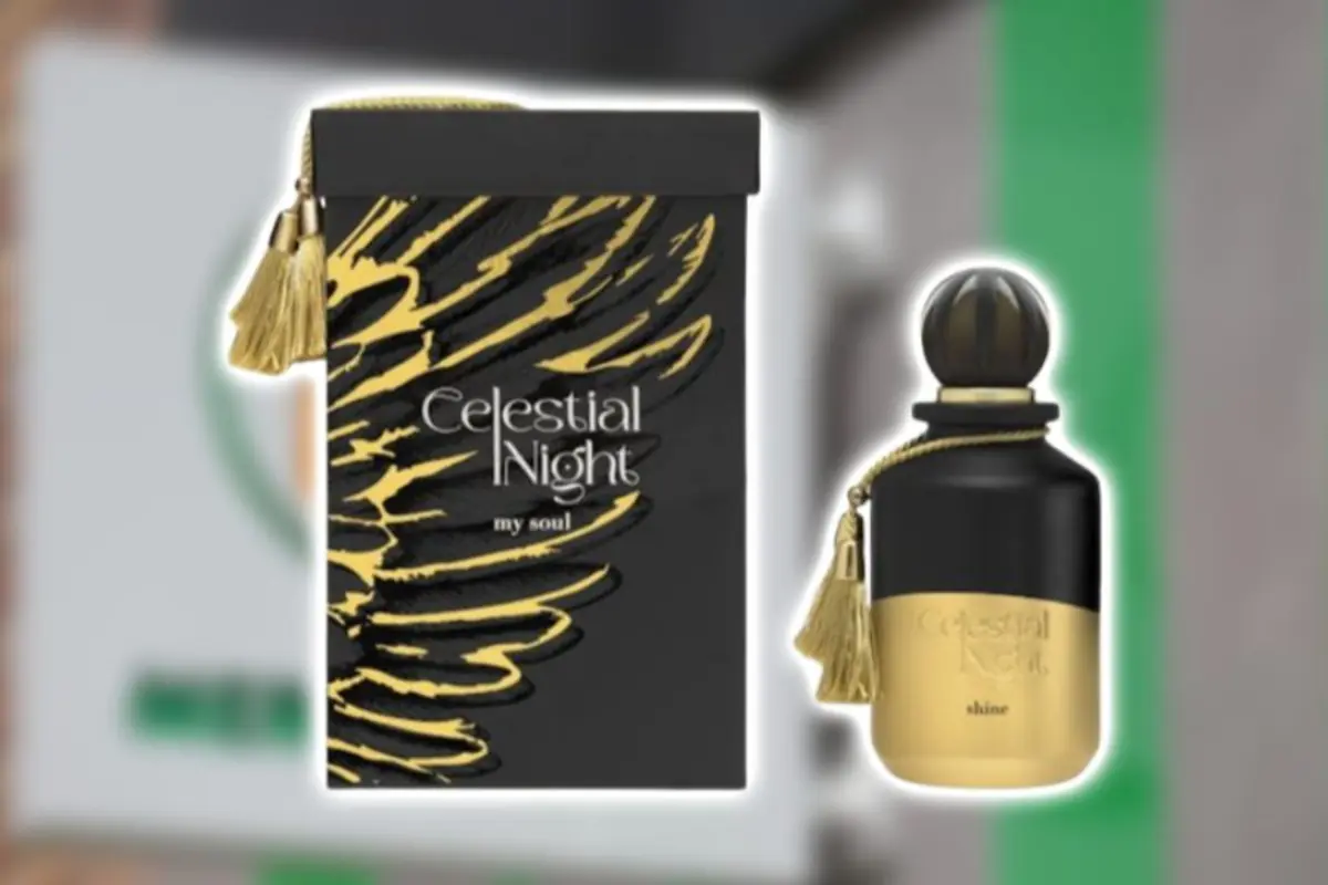 Caja y frasco de perfume Celestial Night en colores negro y dorado con detalles de borla decorativa