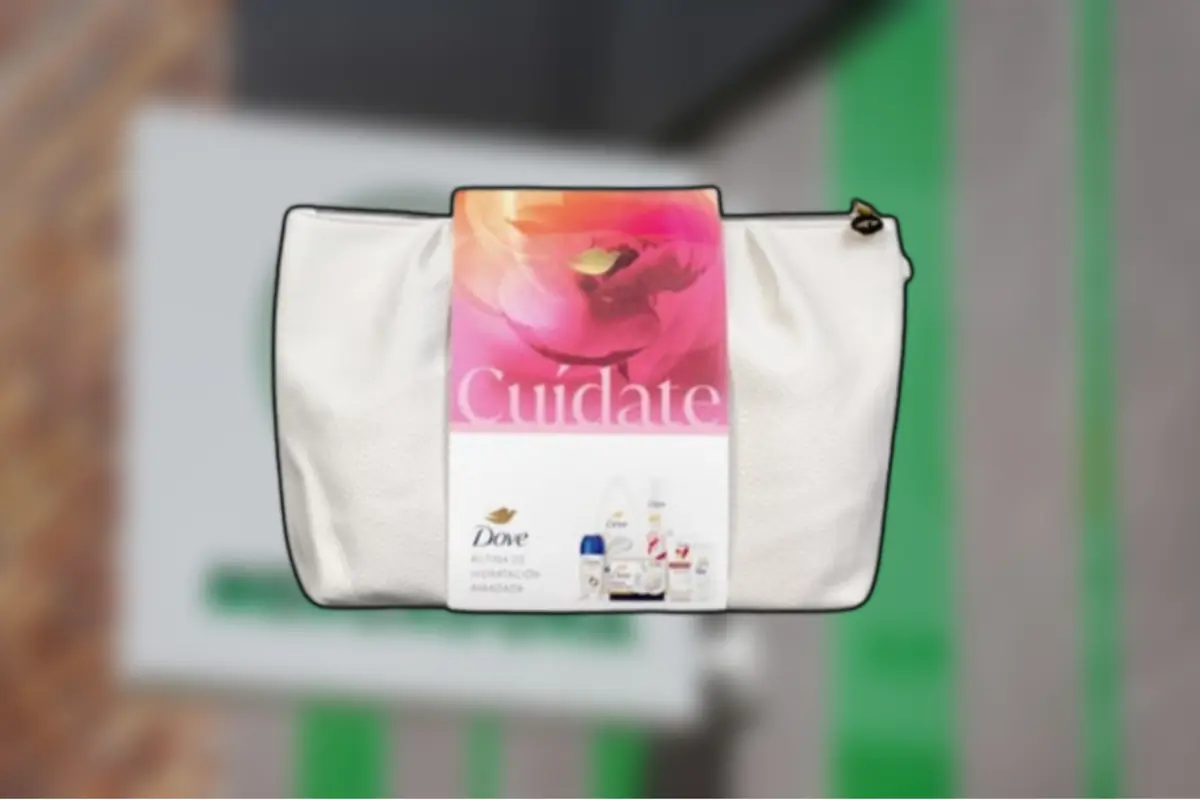 Bolsa cosmética blanca de la marca Dove con banda promocional rosa que dice Cuídate y muestra varios productos de cuidado personal
