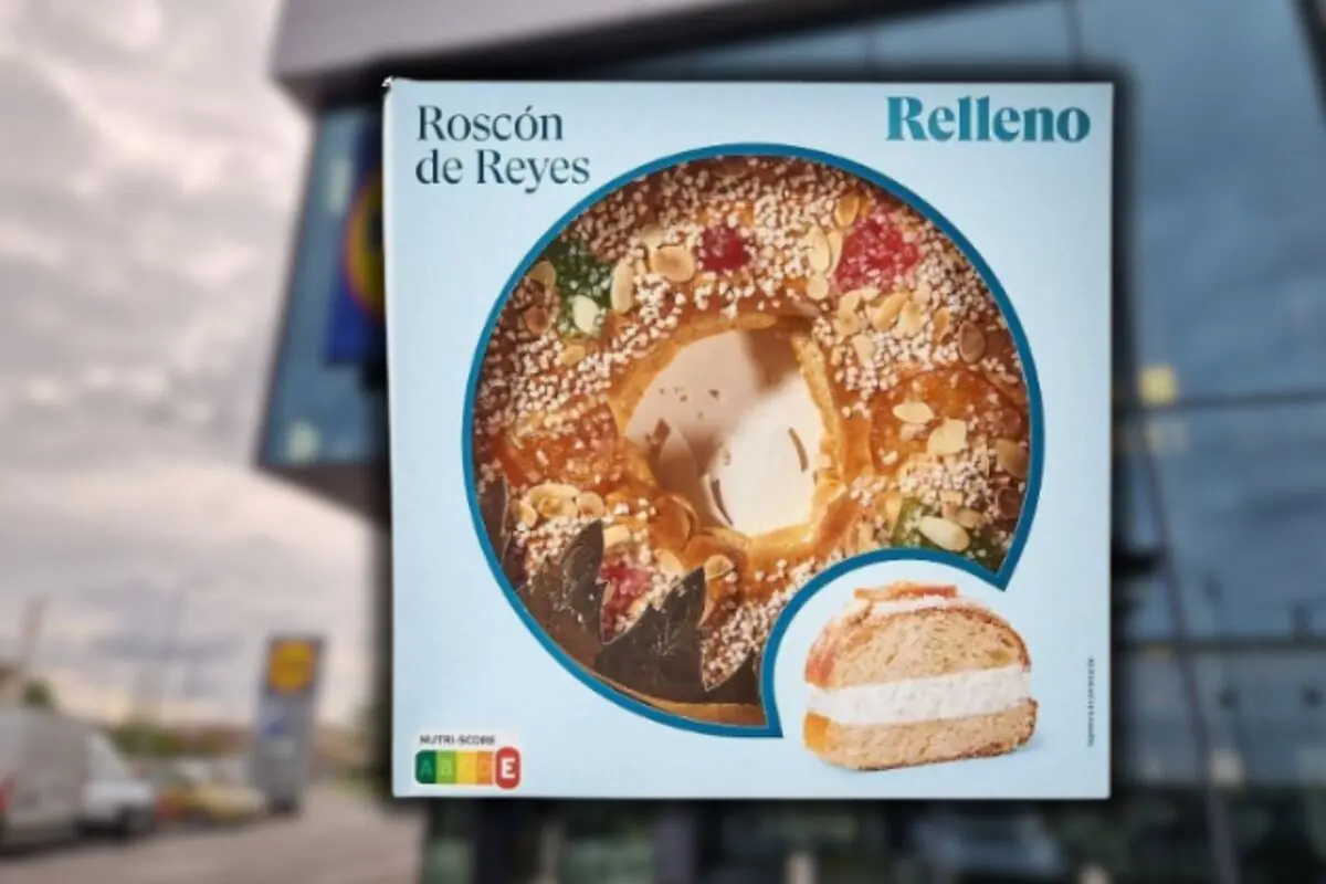 Box of filled Roscón de Reyes with an image of the sweet bread decorated with candied fruit and almonds and a sliced piece showing the whipped cream filling