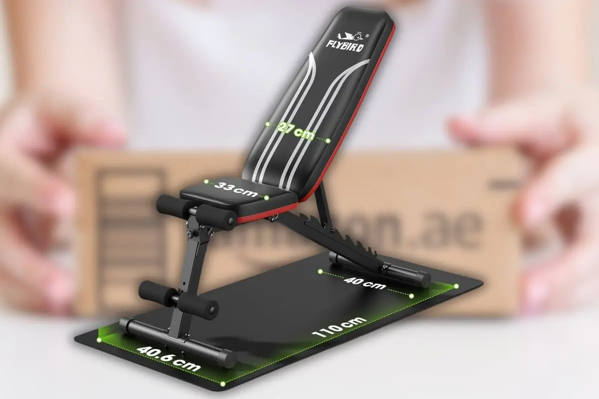 Banco de pesas ajustable Flybird negro con detalles rojos mostrando medidas en centímetros sobre una base rectangular Banco de pesas ajustable Flybird negro con detalles rojos mostrando medidas en centímetros sobre una base rectangular