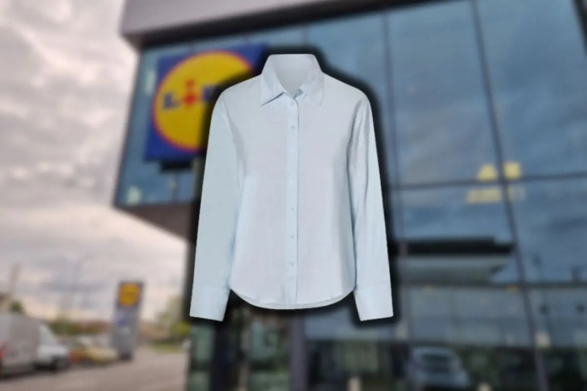 White long-sleeve jersey against a blurred background of a supermarket facade