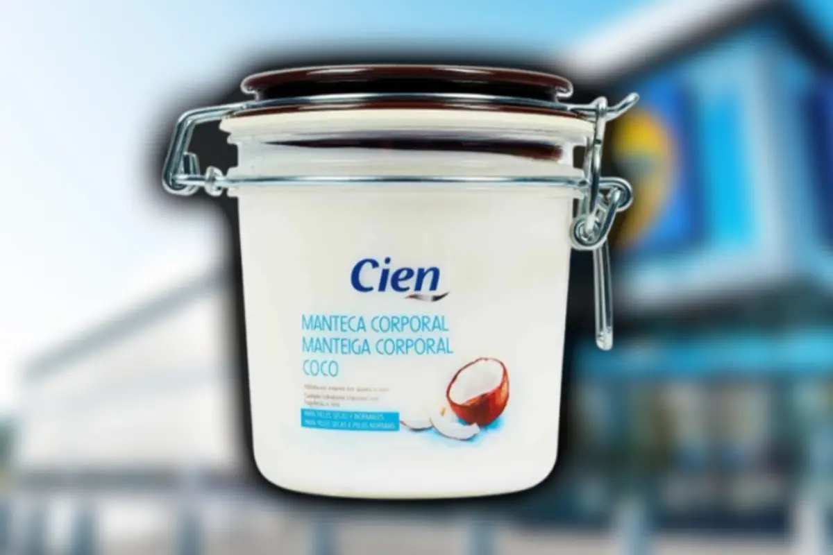 Cien brand coconut body butter container in a white jar with an airtight lid and a blurred supermarket background