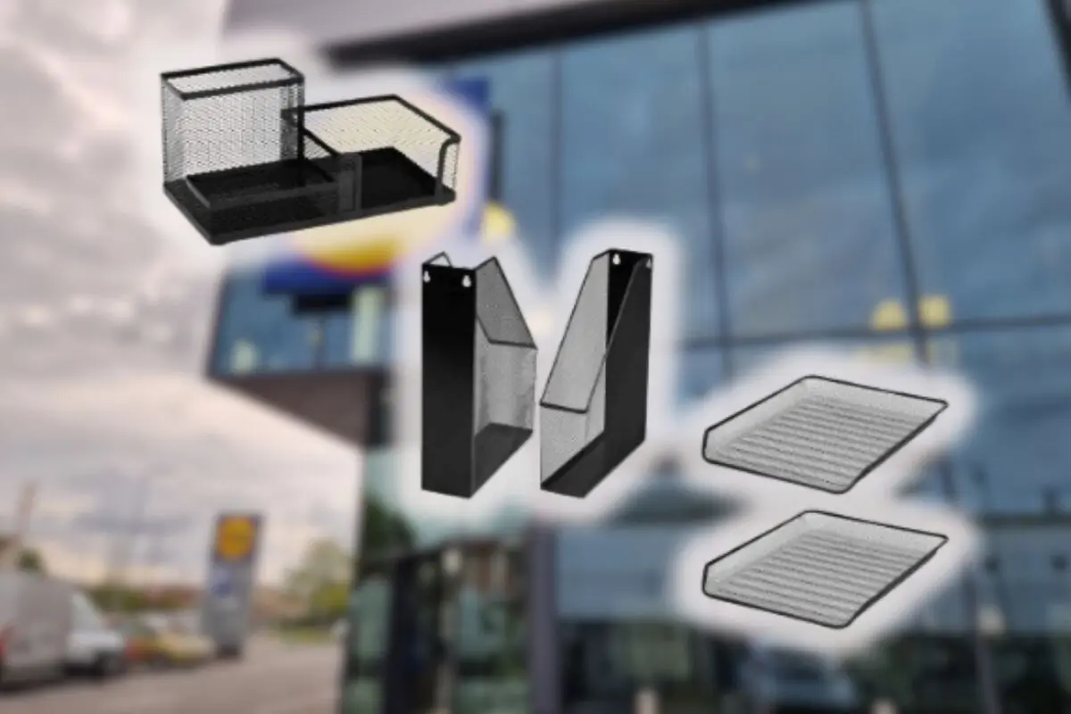 Metal mesh desktop organizers floating over a blurred office building background