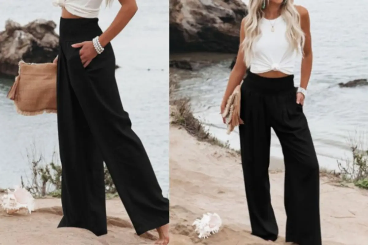 Mujer en la playa con top blanco anudado y pantalones palazzo negros de tiro alto llevando bolso de mano de rafia Mujer en la playa con top blanco anudado y pantalones palazzo negros de tiro alto llevando bolso de mano de rafia