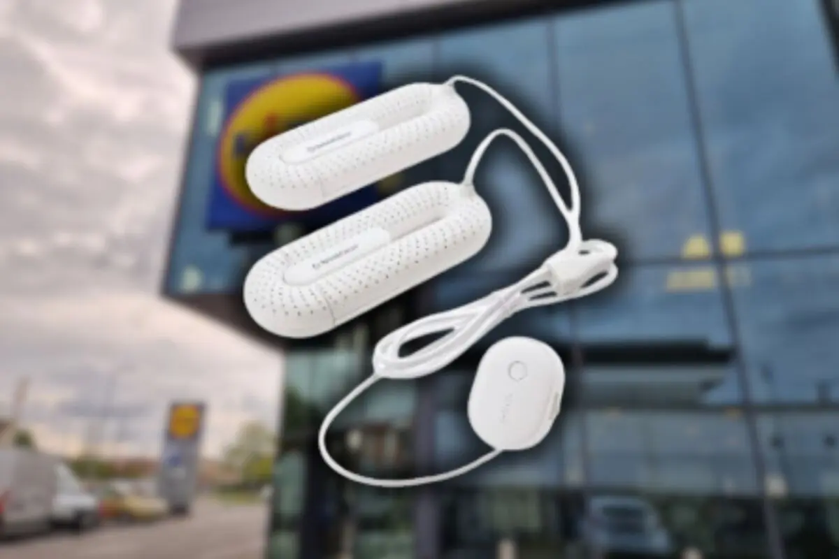 White electric dehumidifier for footwear shown against a blurred background of a supermarket facade