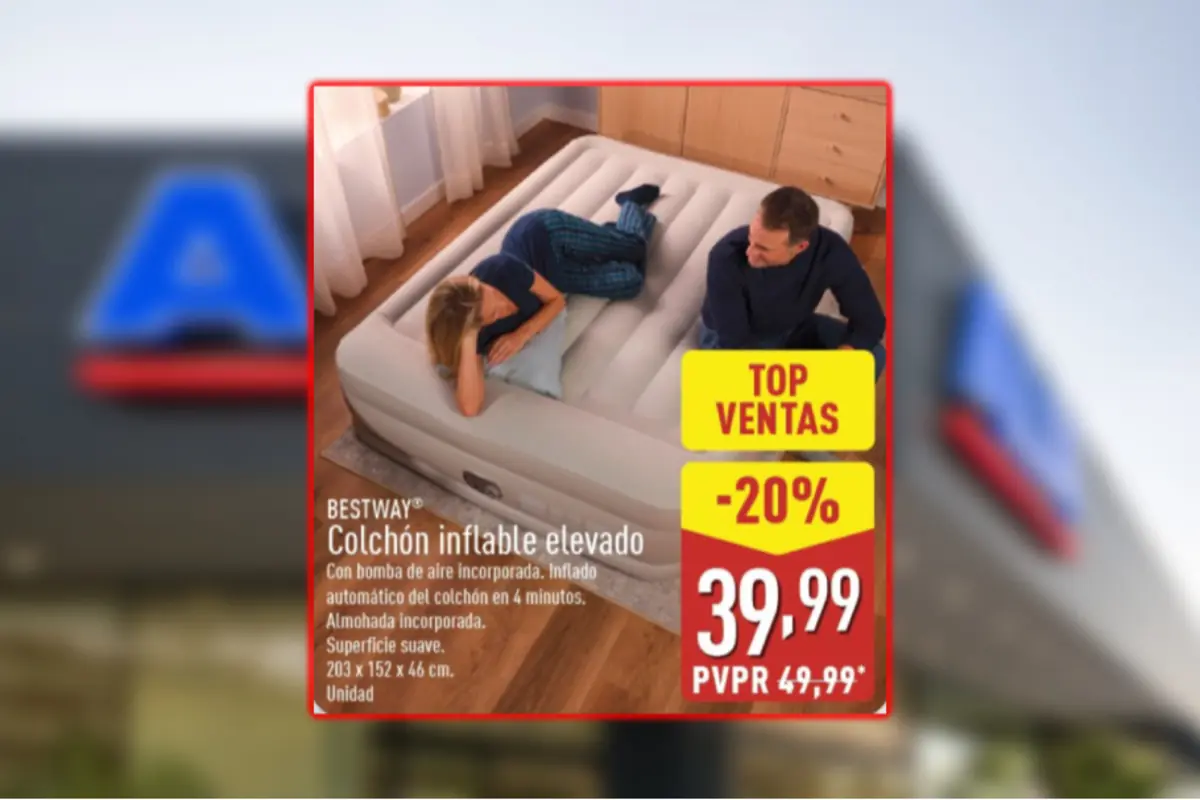 Publicidad de un colchón inflable elevado Bestway con bomba de aire incorporada donde una pareja lo prueba en un dormitorio y se destaca un descuento del 20 por ciento con precio final 39,99 euros sobre fondo de tienda desenfocado