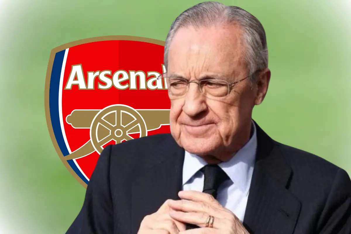 Home gran amb vestit fosc davant de l’escut de l’Arsenal sobre fons verd