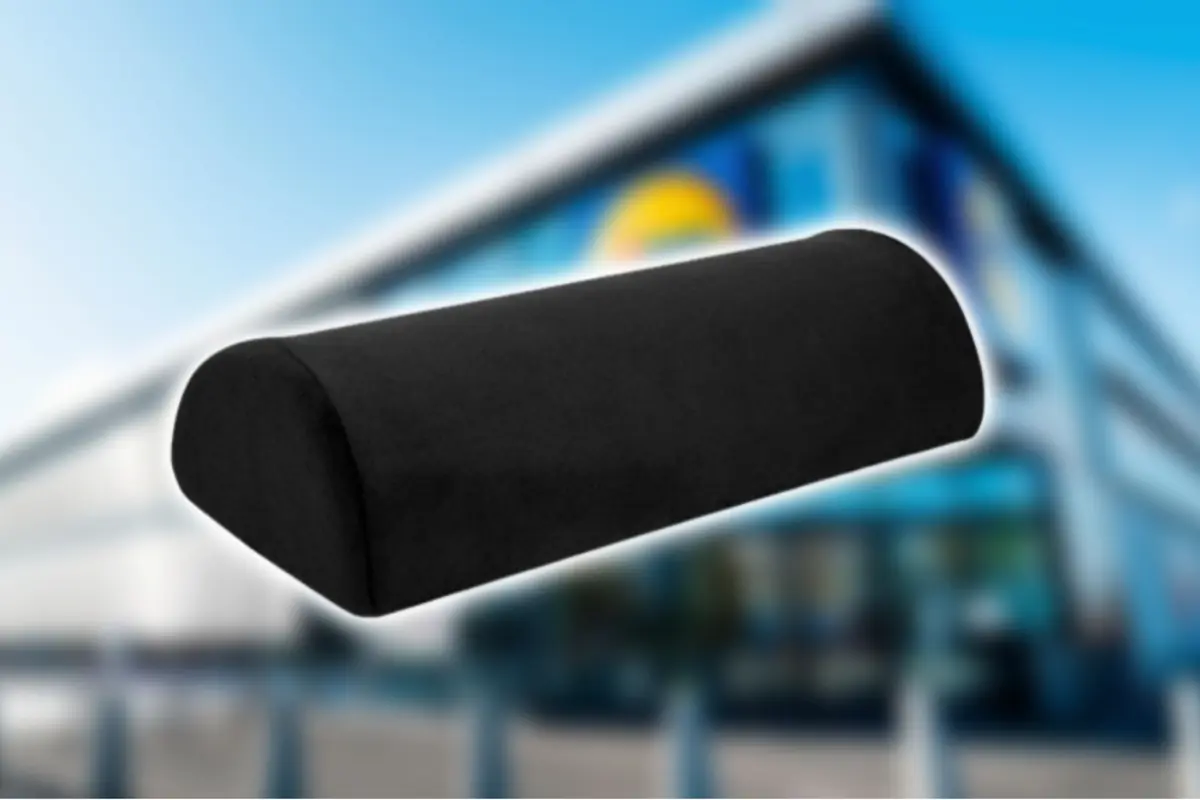 Black ergonomic semi-cylindrical cushion on a blurred background of a modern building