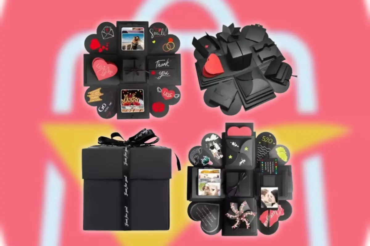 Caja de regalo negra tipo explosiva abierta y cerrada mostrando compartimentos desplegables con fotos mensajes románticos y decoraciones sobre el logo desenfocado de AliExpress