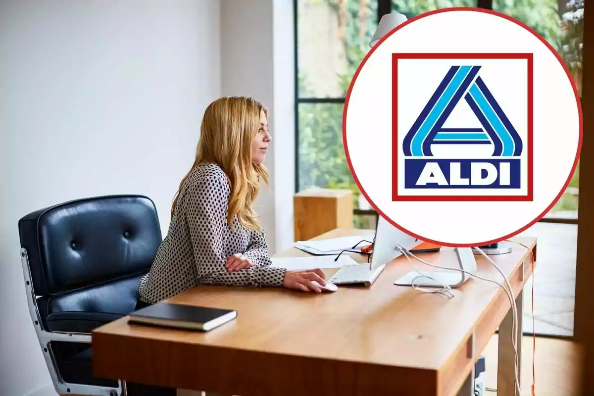 Dona treballant a una oficina amb el logotip d'Aldi en primer pla.