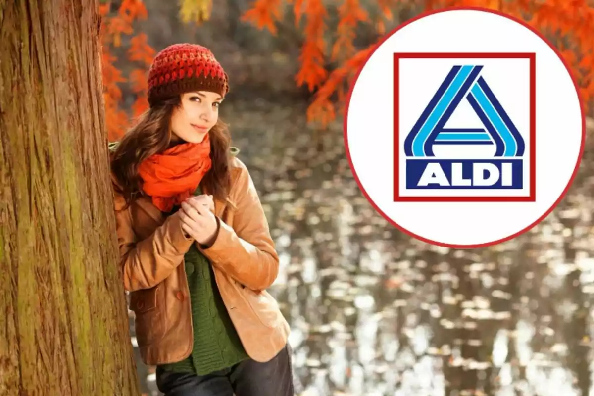 Una dona amb gorra i bufanda de colors de tardor recolzada en un arbre al costat d'un logotip d'Aldi.