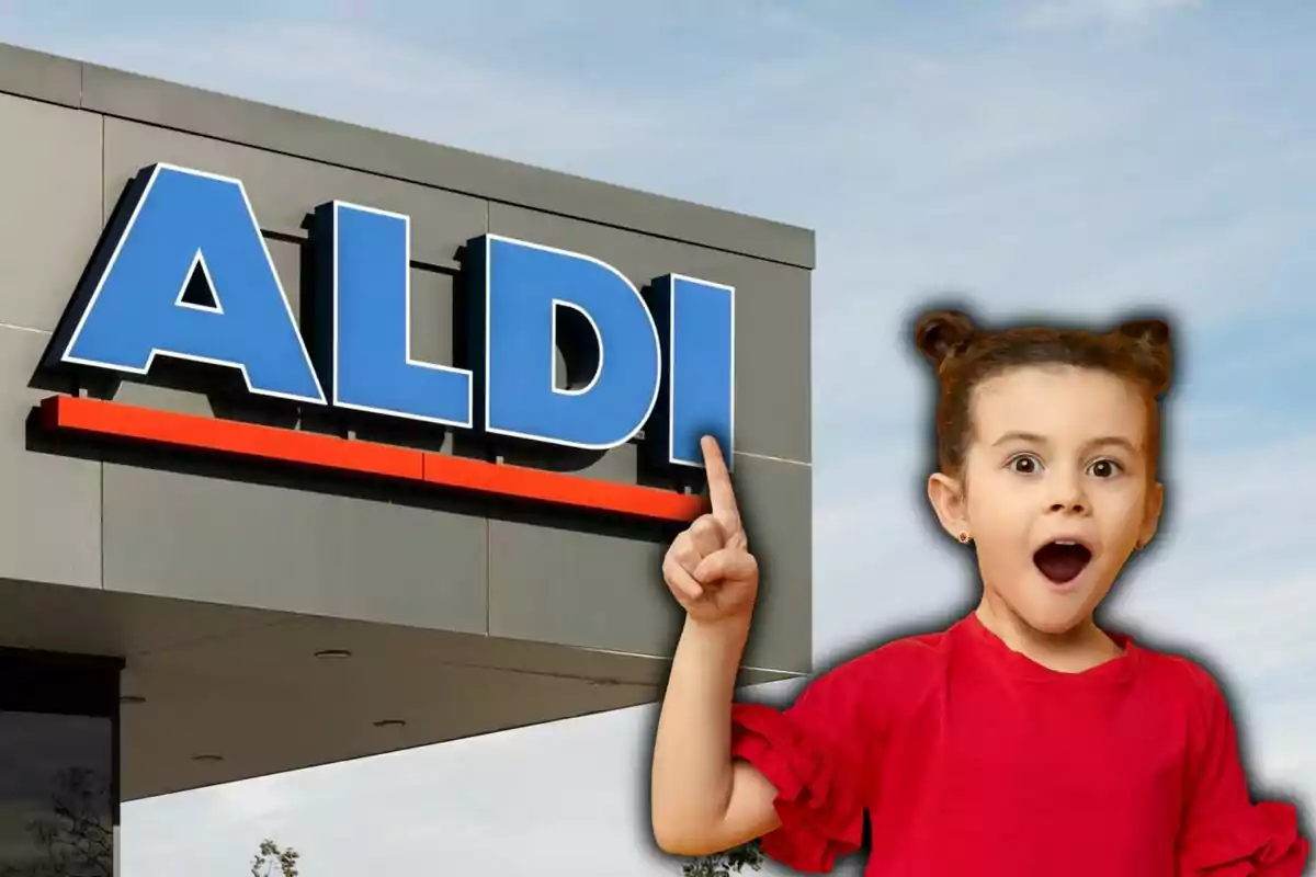 Nena sorpresa assenyalant el rètol d'una botiga Aldi.