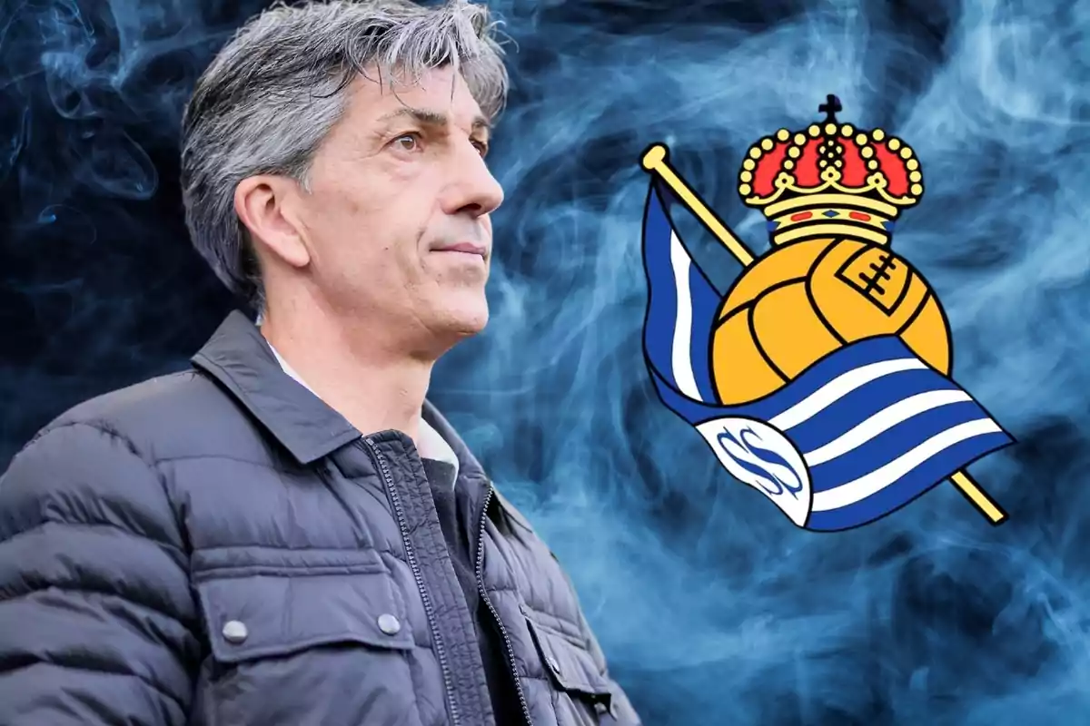 Home de cabell canós amb jaqueta negra davant de l'escut de la Reial Societat sobre un fons de fum blau. Home de cabell canós amb jaqueta negra davant de l'escut de la Reial Societat sobre un fons de fum blau.