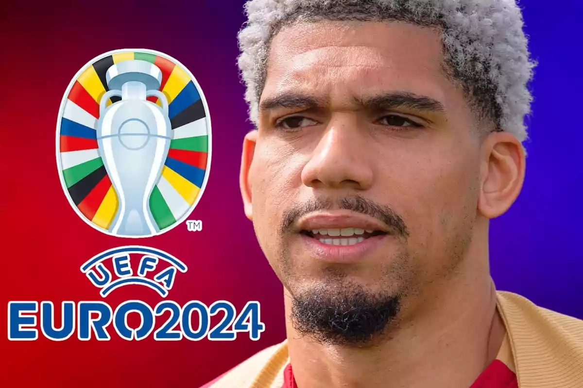 Un home amb cabell arrissat i barba, al costat del logotip de la UEFA Euro 2024.