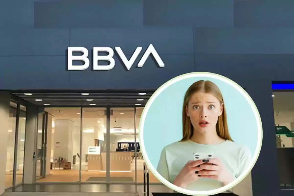 Fachada de una sucursal de BBVA con una imagen insertada de una mujer sorprendida mirando su teléfono móvil.