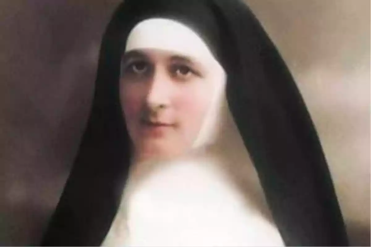 Una monja amb hàbit negre i blanc mirant cap a la càmera. Una monja amb hàbit negre i blanc mirant cap a la càmera.