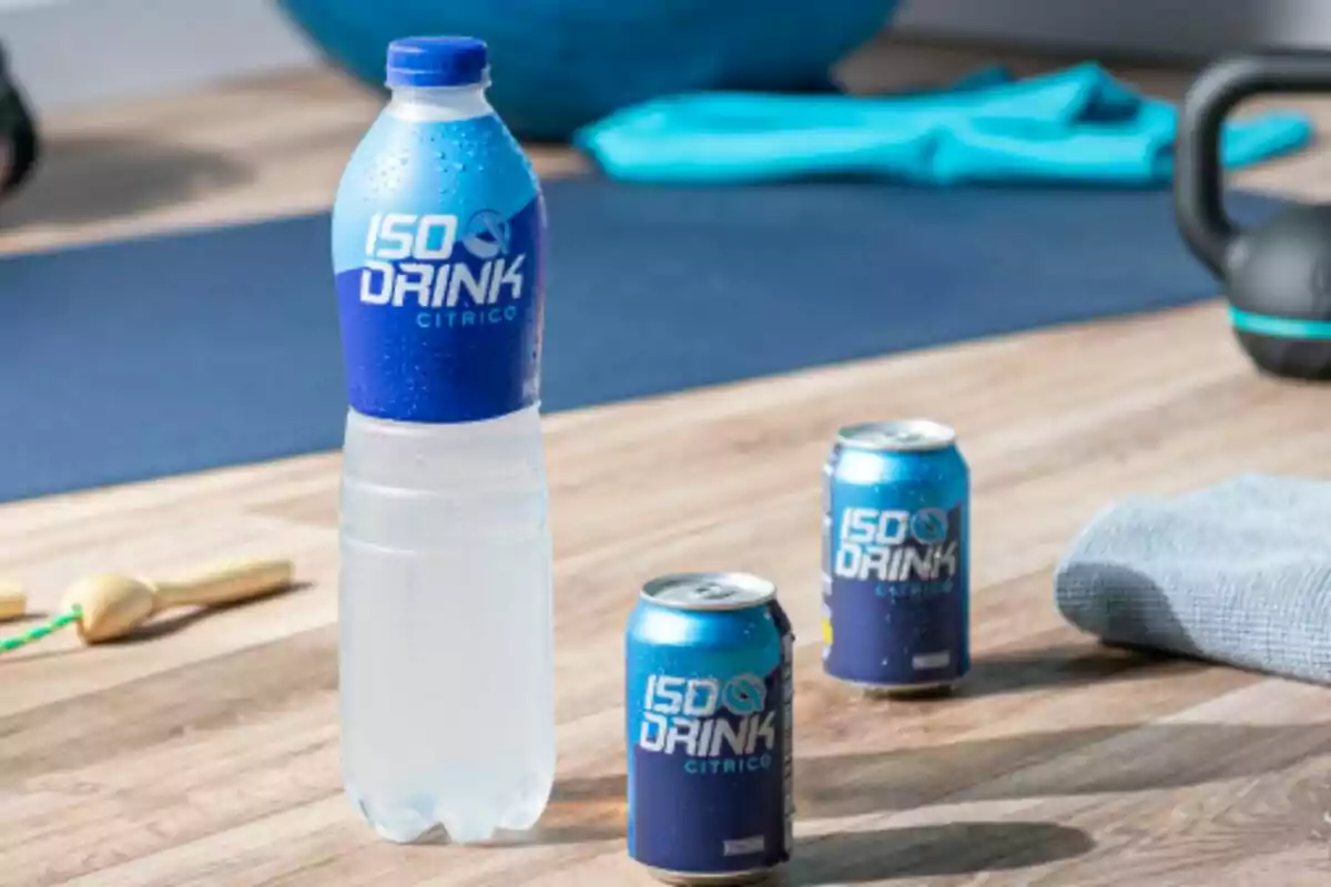 A bottle and two cans of isotonic drink labeled A bottle and two cans of isotonic drink labeled