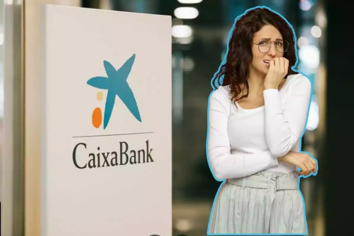 Una dona amb expressió de preocupació està dreta amb un cartell de CaixaBank.