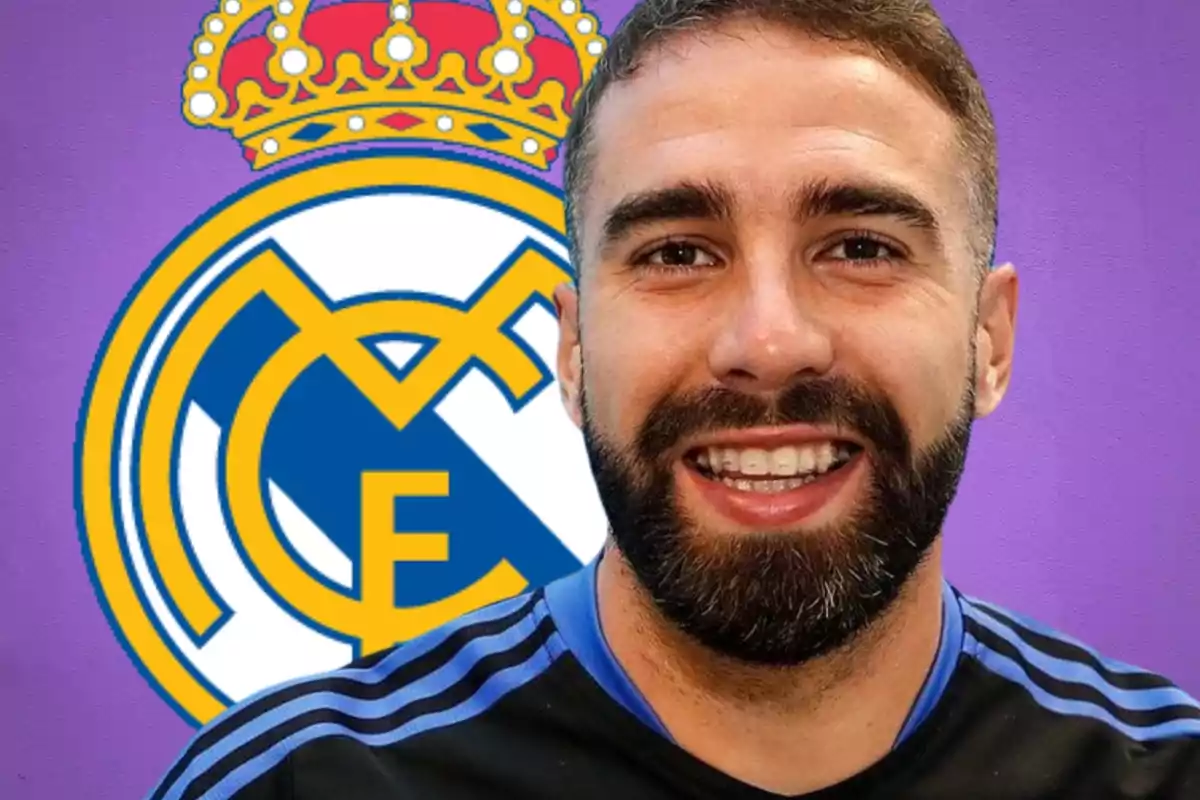 A smiling man with a beard in front of the Real Madrid crest on a purple background.