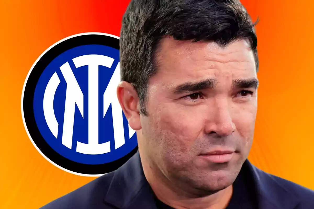 A man with a serious expression in front of an orange background with the Inter Milan logo. A man with a serious expression in front of an orange background with the Inter Milan logo.