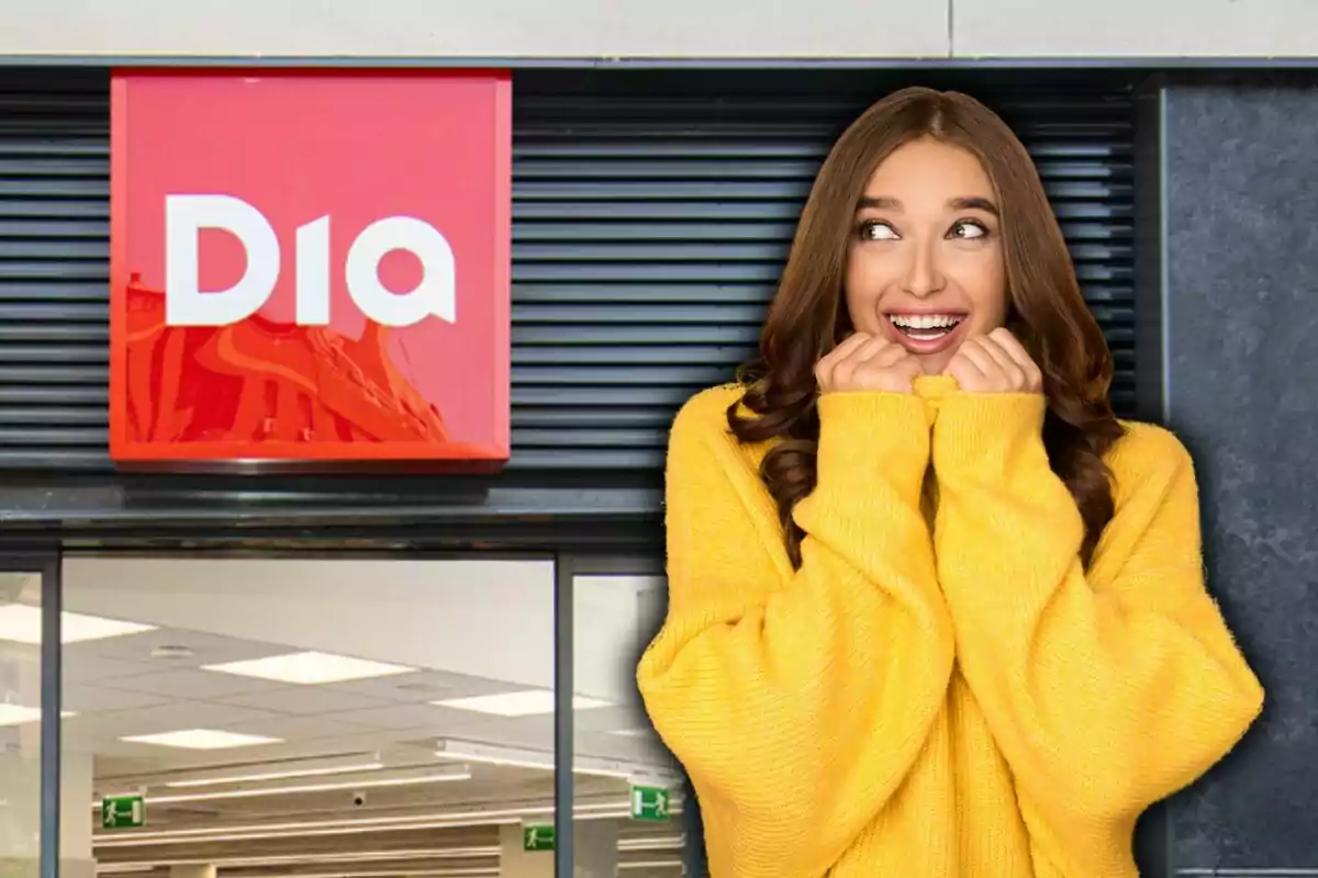 Mujer sonriente con suéter amarillo frente a una tienda con el logo de Dia.