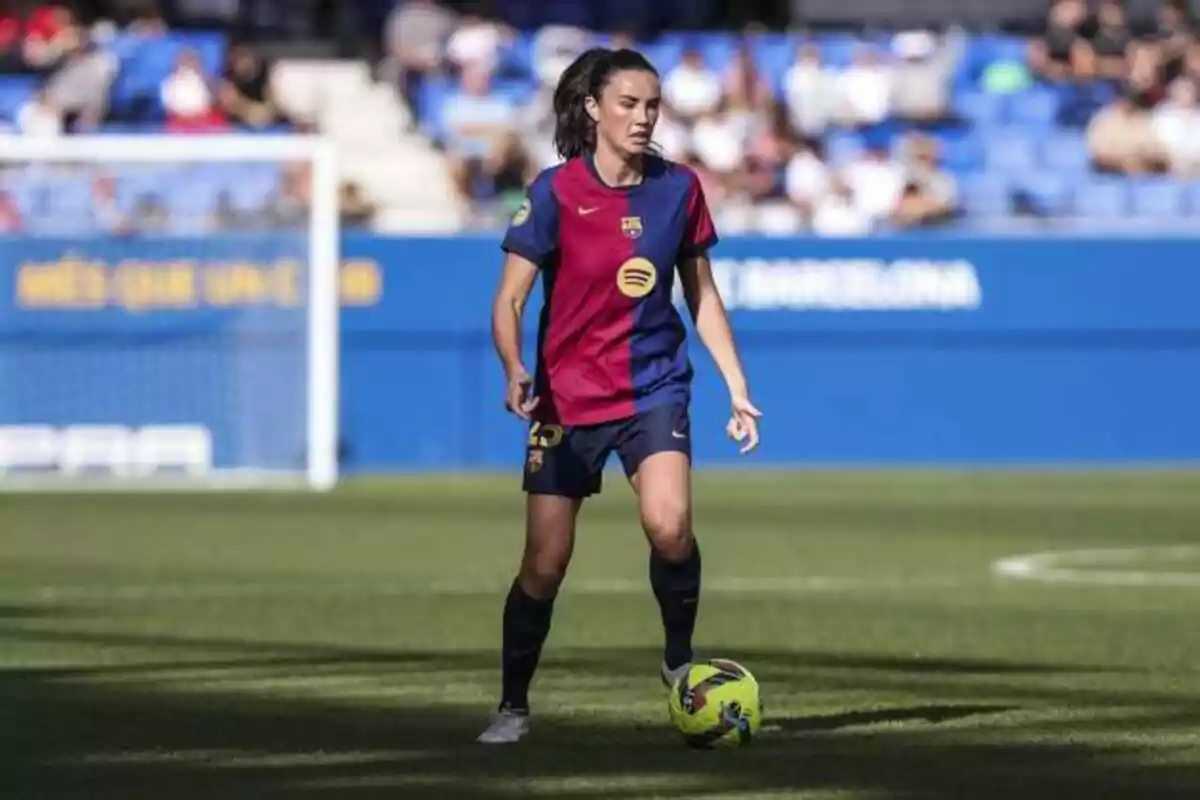 Barcelona women's player controlling the ball on the field during a match Barcelona women's player controlling the ball on the field during a match