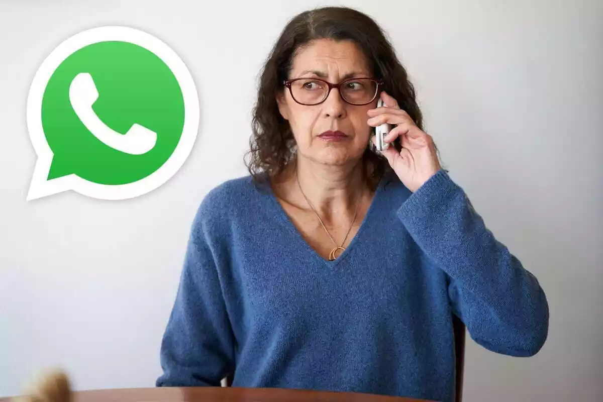 Una dona parla per telèfon mòbil i el logo de WhatsApp