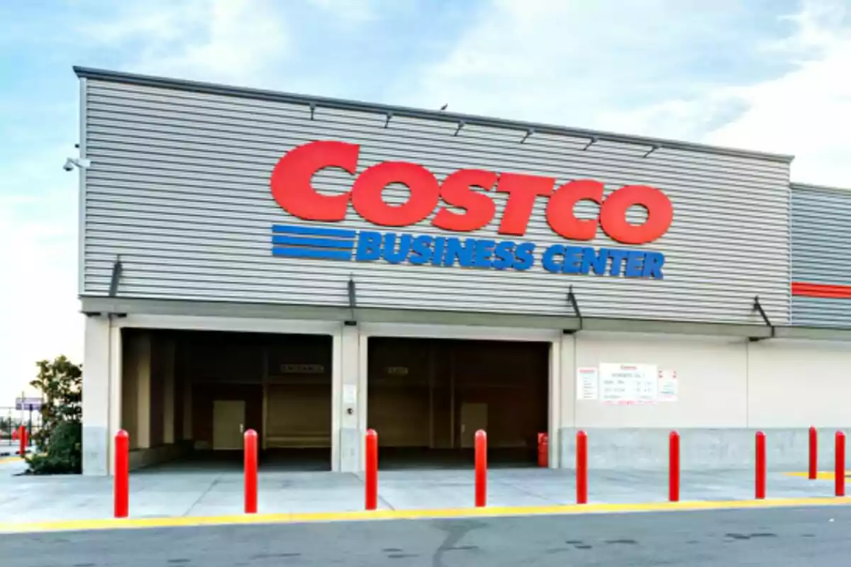 Facade of a business center of a wholesale store with a large sign and red posts at the entrance. Facade of a business center of a wholesale store with a large sign and red posts at the entrance.