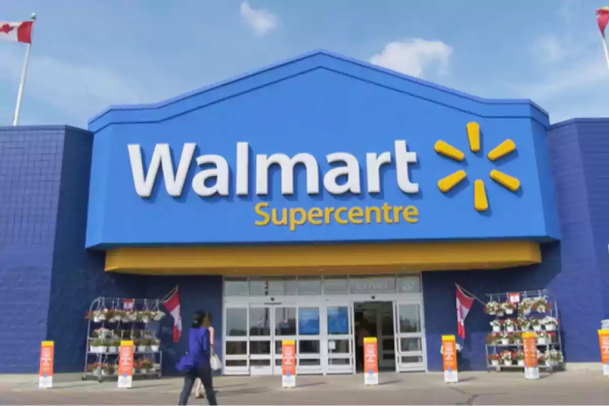 Facade of a Walmart Supercenter with a person walking toward the entrance.