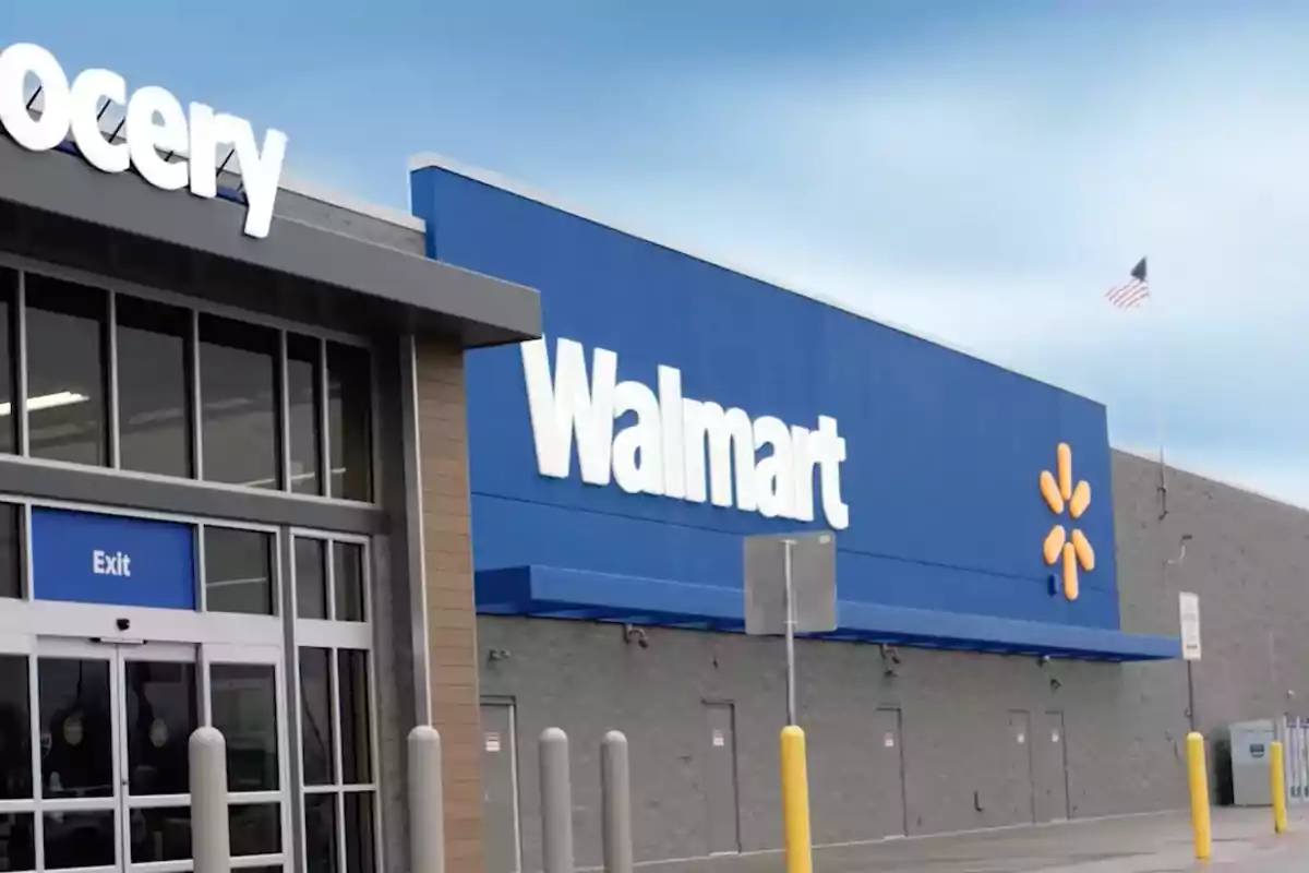 Facade of a Walmart store with a large sign and visible exit entrance.