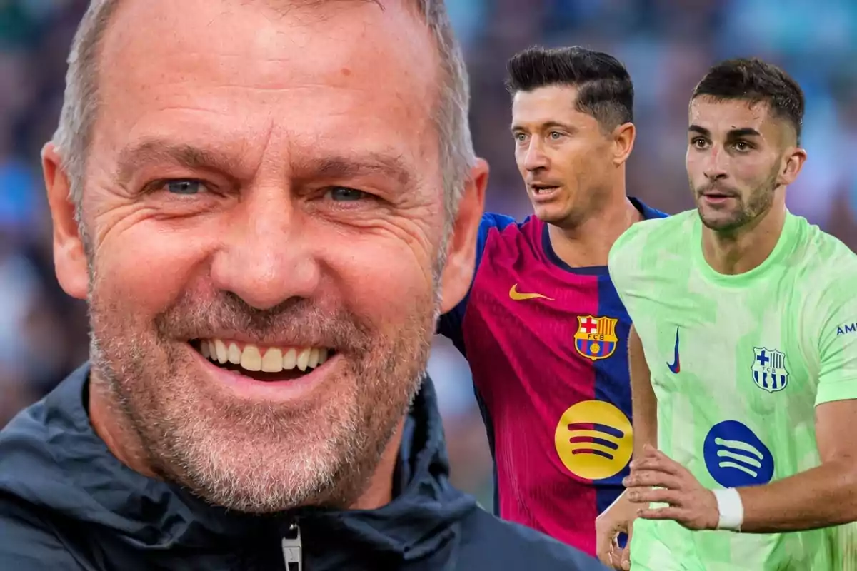 A smiling man in the foreground and two Barcelona players in the background, one wearing a blue and red uniform and the other wearing a green uniform.