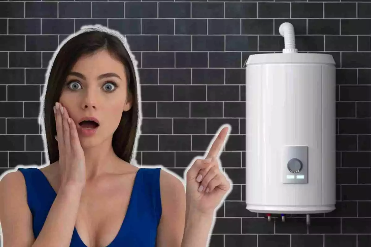 Surprised woman pointing at a water heater on a black tiled wall.