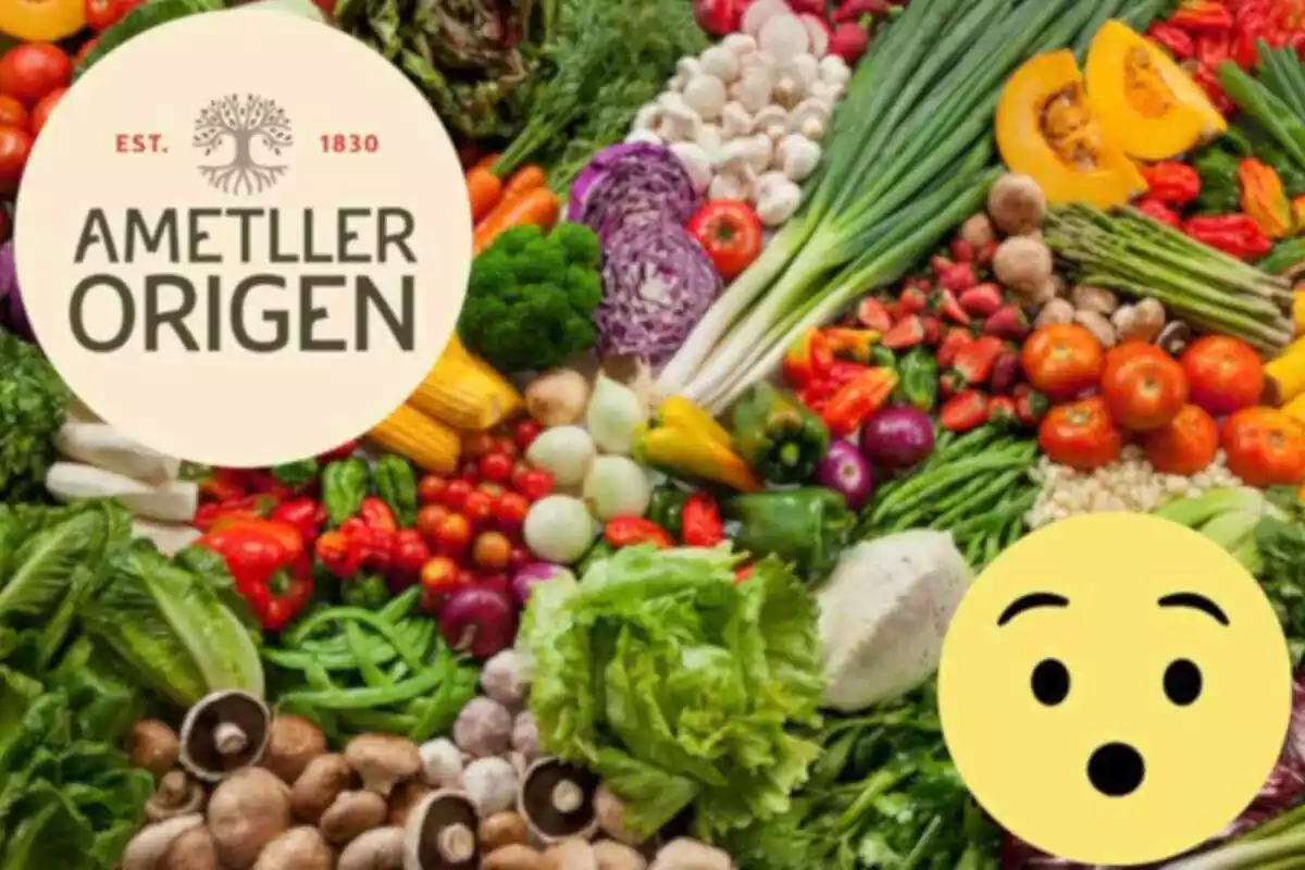 Fotomuntatge amb una imatge de fons de fruites i verdures i al capdavant el logotip d'Ametller Origen i una cara d'un emoji sorprès