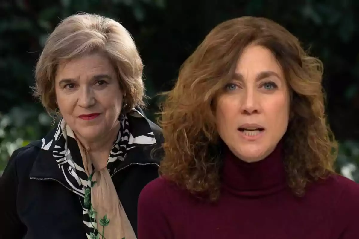 Two middle-aged women pose in front of a dark background, one with short blonde hair and the other with curly brown hair.