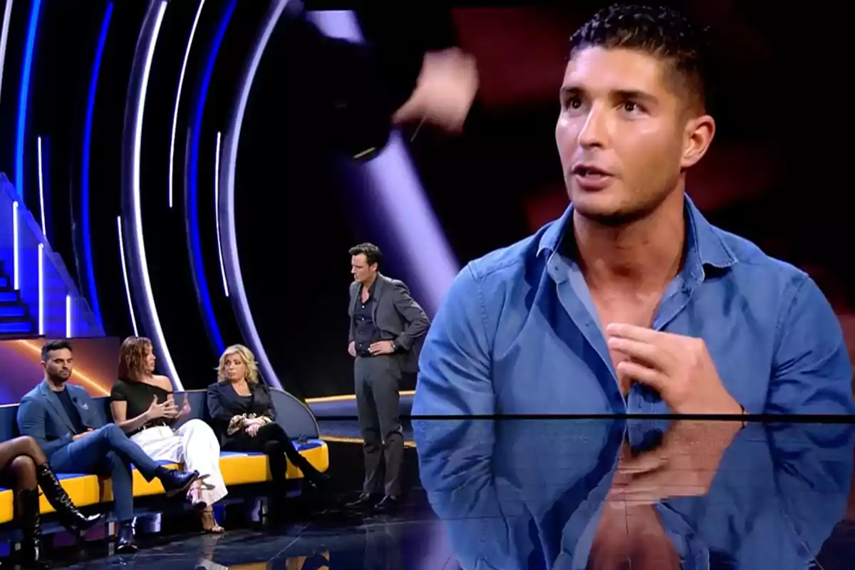 A group of people is sitting on a television set with blue and yellow lights, while Ion Aramendi appears to be talking to them. Capture from 'GH Dúo'.