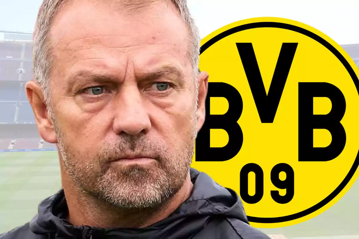 Un home amb expressió seriosa davant del logo del Borussia Dortmund.