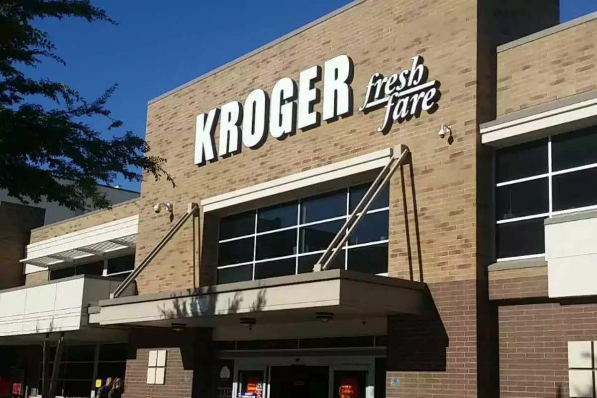 Facade of a Kroger Fresh Fare store with large white letters on a brick wall under a clear sky. Facade of a Kroger Fresh Fare store with large white letters on a brick wall under a clear sky.