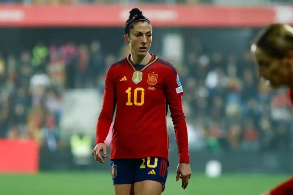 A player in the red uniform of the Spanish national team on the field. A player in the red uniform of the Spanish national team on the field.