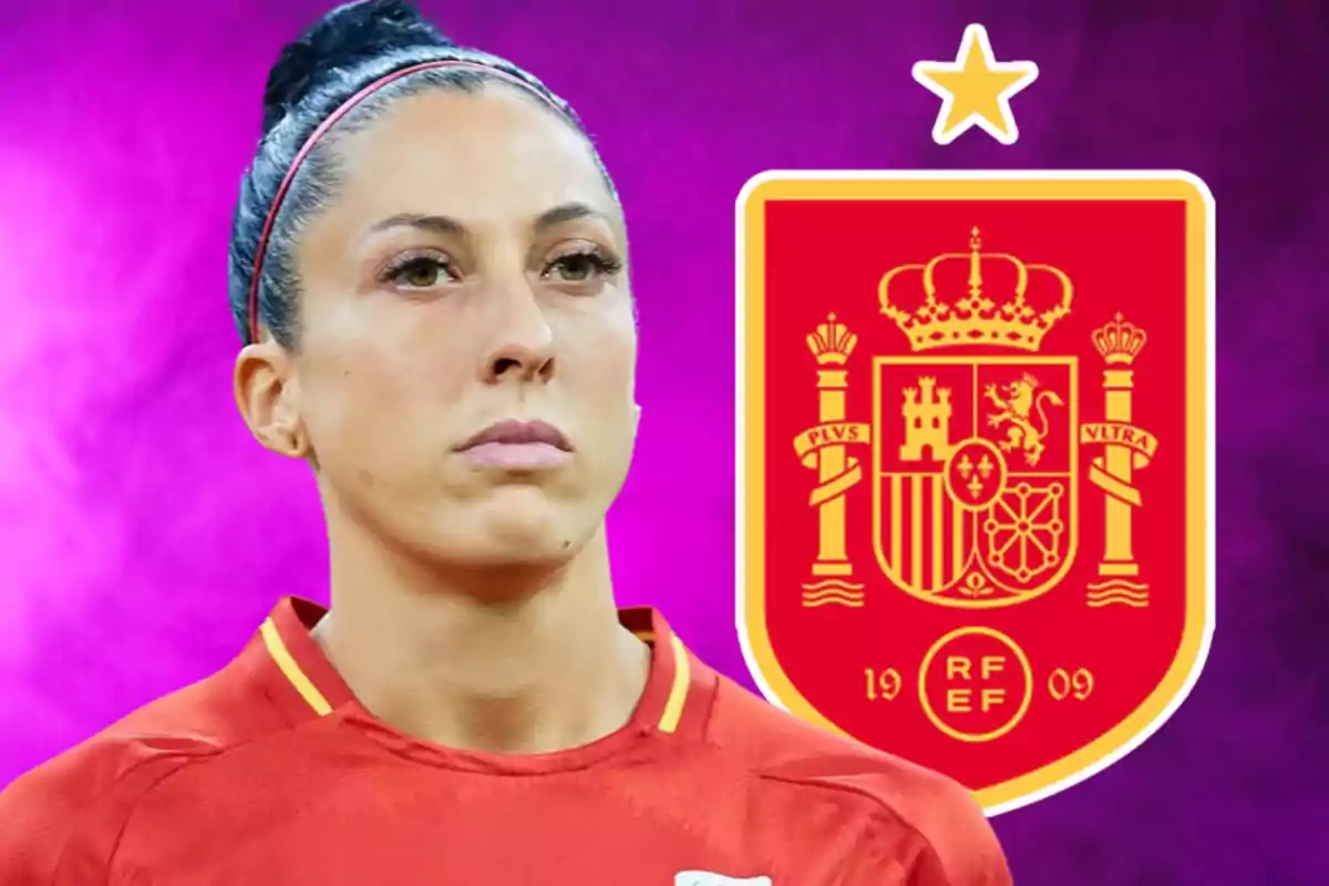 A person in a red uniform in front of the Spanish national soccer team crest on a purple background.