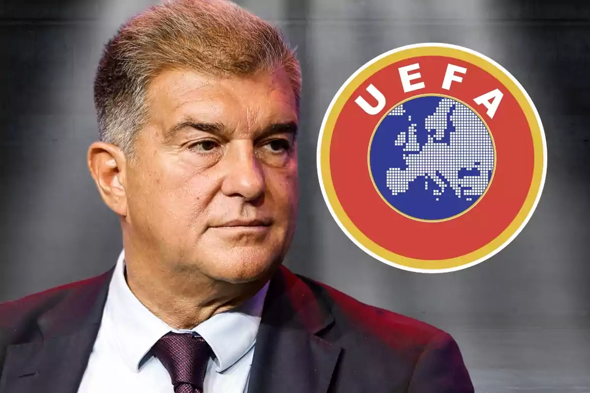 Home amb vestit i expressió seriosa amb el logotip de la UEFA al fons