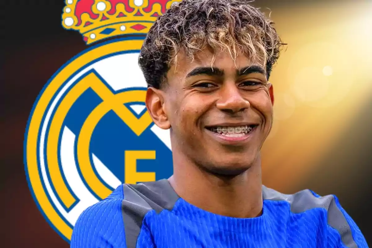 Young player smiling with the Real Madrid crest in the background